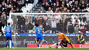 (John Walton/PA via AP) : West Ham United's Axel Disasi, center right, scores their side's second goal during their English FA Cup, quarter-final soccer match against Leeds United in London, Sunday, April 5, 2026.