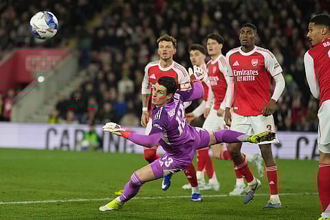 Arsenal's goalkeeper Kepa Arrizabalaga watches the ball during the English FA Cup quaterfinal soccer match between Southampton and Arsenal in Southampton, England.