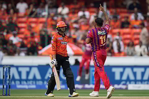 Lucknow Super Giants' Mohammed Shami, right, celebrates the wicket of Sunrisers Hyderabad's Abhishek Sharma during the Indian Premier League cricket match between Sunrisers Hyderabad and Lucknow Super Giants in Hyderabad, India.