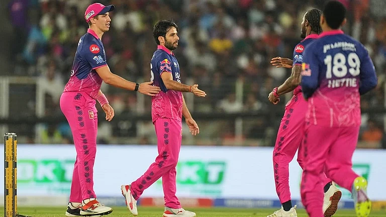 Rajasthan Royals' Ravi Bishnoi, second left, celebrates with teammates the wicket of Gujarat Titans' Sai Sudharsan during the Indian Premier League cricket match between Gujarat Titans and Rajasthan Royals in Ahmedabad. - | Photo: AP/Ajit Solanki