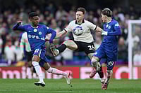 Chelsea Vs Port Vale, FA Cup 2025-26 Quarter-Final: Blues Thrash League One Side 6-0 At Stamford Bridge - In Pics | Photo: AP/Ian Walton : Port Vale's Kyle John, centre, in action against Chelsea's Estevao, left, and Chelsea's Alejandro Garnacho during the English FA Cup quarterfinal soccer match between Chelsea and Port Vale in London, England.