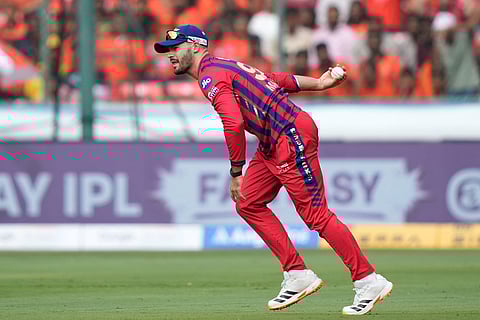 Lucknow Super Giants' Aiden Markram reacts after taking catch of Sunrisers Hyderabad's Travis Head during the Indian Premier League cricket match between Sunrisers Hyderabad and Lucknow Super Giants in Hyderabad, India.