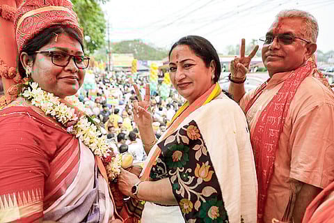In this image posted on April 4, 2026, Delhi Chief Minister Rekha Gupta, centre, during a roadshow in support of BJP candidate Dilip Ghosh ahead of the Assembly elections, in Kharagpur, West Bengal.