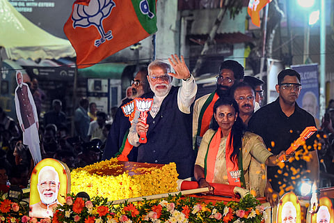 Prime Minister Narendra Modi during a roadshow ahead of the Kerala Assembly elections, in Thiruvananthapuram, Kerala.