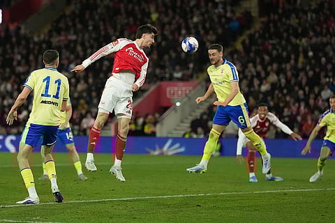 Arsenal's Kai Havertz, centre left, and Southampton's Taylor Harwood-Bellis challenge for the ball during the English FA Cup quaterfinal soccer match between Southampton and Arsenal in Southampton, England.