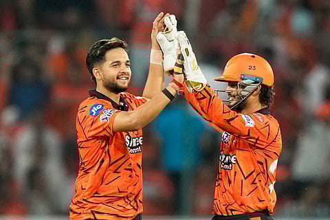 Sunrisers Hyderabad's Harsh Dubey, left, celebrates the wicket of Lucknow Super Giants' Ayush Badoni during the Indian Premier League cricket match between Sunrisers Hyderabad and Lucknow Super Giants in Hyderabad, India.