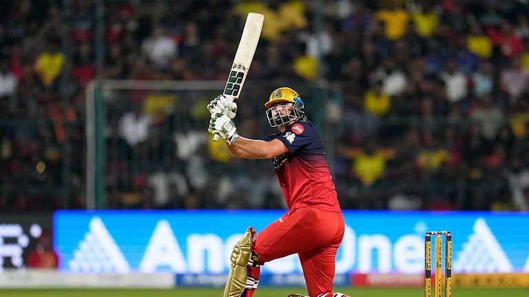 Royal Challengers Bengaluru's Tim David plays a shot during the Indian Premier League cricket match between Chennai Super Kings and Royal Challengers Bengaluru in Bengaluru, India, Sunday, April 5, 2026. - (AP Photo/Aijaz Rahi)