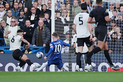 Chelsea's Cole Palmer, centre, scores his side's third goal during the English FA Cup quarterfinal soccer match between Chelsea and Port Vale in London, England.