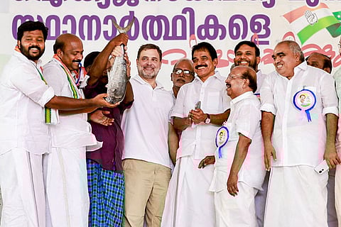 In this image posted on April 4, 2026, Leader of Opposition in Lok Sabha and Congress leader Rahul Gandhi, centre, with party MP KC Venugopal, and others, during a public meeting ahead of Kerala Assembly elections, in Alappuzha, Kerala.
