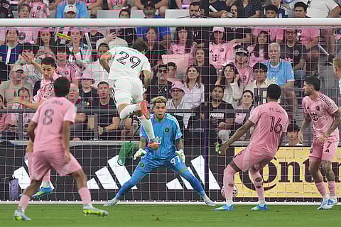 Austin FC defender Guilherme Biro (29) scores with a header past Inter Miami goalkeeper Dayne St. Clair (97) during the first half of an MLS soccer match in Miami.