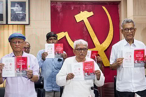 Left Front Chairman Biman Bose, front centre, CPI(M) leader Sridip Bhattacharya, left, CPI leader Swapan Banerjee, right, and others release the election manifesto during a press conference, ahead of the West Bengal Assembly polls, at Muzaffar Ahmad Bhawan, in Kolkata.