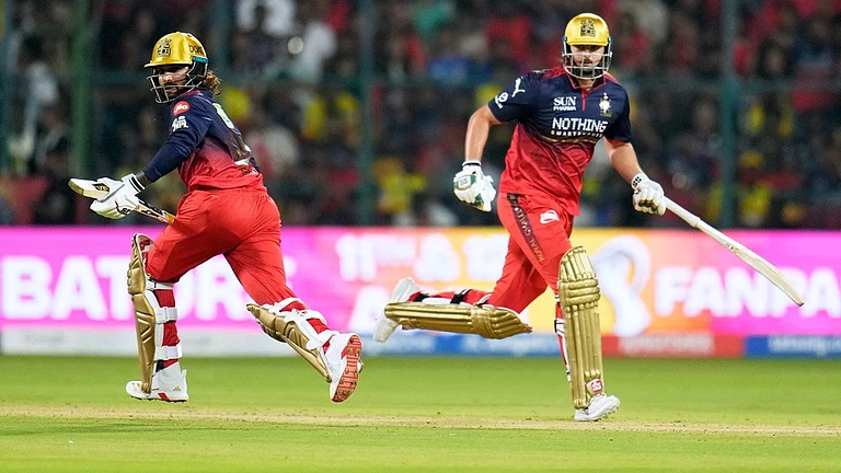 Royal Challengers Bengaluru's captain Rajat Patidar, left, and batting partner Tim David run between the wickets during their Indian Premier League match against Chennai Super Kings in Bengaluru. - AP