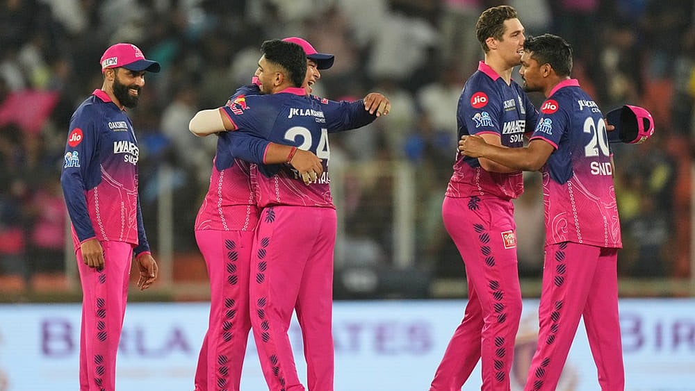 Rajasthan Royals players celebrate after winning the Indian Premier League cricket match against Gujarat Titans in Ahmedabad. - | Photo: AP/Ajit Solanki