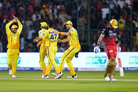 Chennai Super Kings' Anshul Kamboj, center, celebrates with teammates the wicket of Royal Challengers Bengaluru's Virat Kohli, right, during the Indian Premier League cricket match between Chennai Super Kings and Royal Challengers Bengaluru in Bengaluru, India.