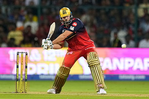 Royal Challengers Bengaluru's Tim David plays a shot during the Indian Premier League cricket match between Chennai Super Kings and Royal Challengers Bengaluru in Bengaluru, India.