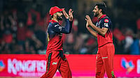 Bhuvneshwar Kumar Scripts History, Becomes First Pacer to Join The 200-Wicket Club In IPL IPL/X : Bhuvneshwar Kumar celebrating his wicket with Virat Kohli during RCB vs CSK IPL 2026 match at the M Chinnaswamy Stadium in Bengaluru.
