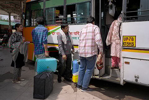 Migrant workers leaving for their hometowns from Kaushambi bus stand in Uttar Pradesh.
