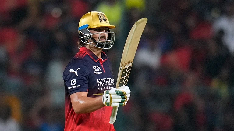 Royal Challengers Bengaluru's Tim David celebrates his fifty runs during the Indian Premier League cricket match between Chennai Super Kings and Royal Challengers Bengaluru in Bengaluru, India, Sunday, April 5, 2026.
- AP Photo/Aijaz Rahi