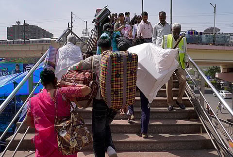 Migrant workers leaving for their hometowns from Kaushambi bus stand in Uttar Pradesh.
