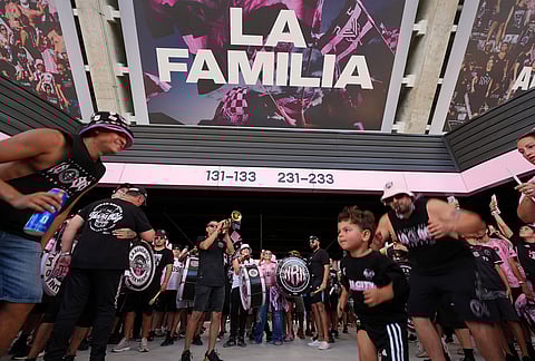 Inter Miami fans dance and play music ahead of the team's first MLS soccer match in their new stadium, against Austin FC in Miami. 