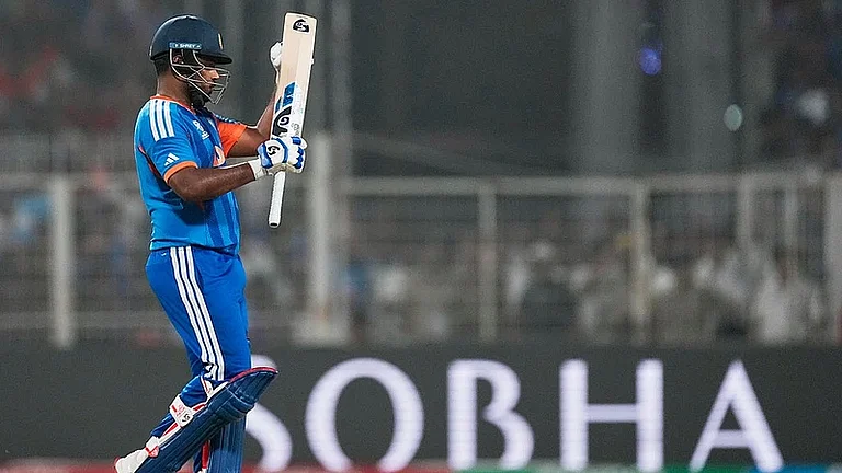 Sanju Samson applauds a shot by Tilak Varma during the T20 World Cup match between India and West Indies in Kolkata. - File/AP
