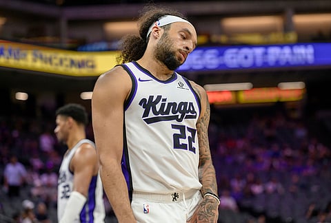 Sacramento Kings guard Devin Carter (22) reacts after losing an NBA basketball game against the Los Angeles Clippers in Sacramento, California.