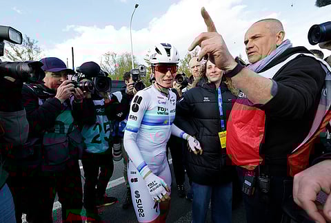 Netherland's Demi Vollering celebrates after winning the Tour of Flanders cycling race, in Oudenaarde, Belgium.