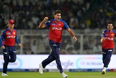 Punjab Kings' Xavier Bartlett celebrates the wicket of Kolkata Knight Riders' Cameron Green during the Indian Premier League cricket match between Kolkata Knight Riders and Punjab Kings in Kolkata.
