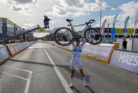 Netherland's Demi Vollering celebrates after winning the Tour of Flanders cycling race, in Oudenaarde, Belgium.