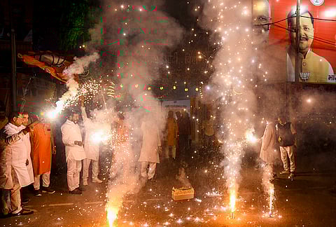 BJP supporters light firecrackers outside the party office to celebrate the foundation day of the Bharatiya Janata Party, in Patna, Bihar.