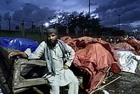 | Photo: Tribhuvan Tiwari/Outlook : Moin (44), a fruit seller at Patparganj, who is the only one in New Delhi. Due to shortage of LPG cylinders he sent his family to their village Gajraula, after surviving on meals of fruit and puffed rice for last 3-4 days. Ghazipur, New Delhi
