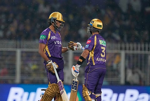 Kolkata Knight Riders' captain Ajinkya Rahane, right, and Akash Deep bump fists during the Indian Premier League cricket match between Kolkata Knight Riders and Punjab Kings in Kolkata.