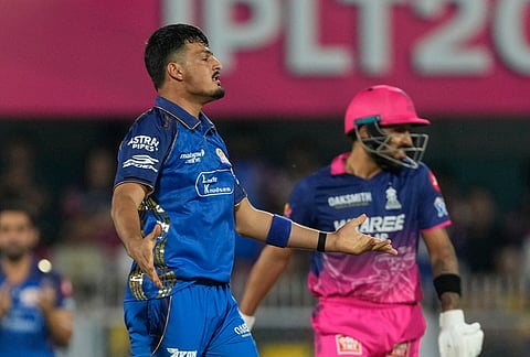 Mumbai Indians' Allah Gazanfar celebrates the wicket of Rajasthan Royals' Dhruv Jurel during the Indian Premier League cricket match between Mumbai Indians and Rajasthan Royals in Guwahati.