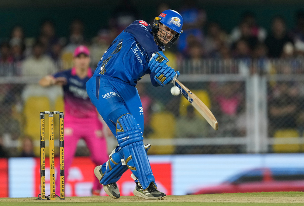 Mumbai Indians' Ryan Rickelton hits a six during the Indian Premier League cricket match between Mumbai Indians and Rajasthan Royals in Guwahati.