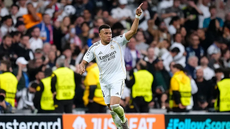 Real Madrid's Kylian Mbappe celebrates scoring his side's first goal during the Champions League quarterfinal first leg soccer match between Real Madrid and Bayern Munich in Madrid, Spain, Tuesday, April 7, 2026 - AP Photo/Jose Breton