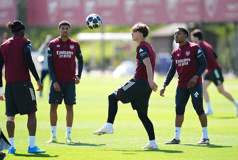 Arsenal's Max Dowman, centre, and team-mates during a training session in London. - | Photo: John Walton/PA via AP