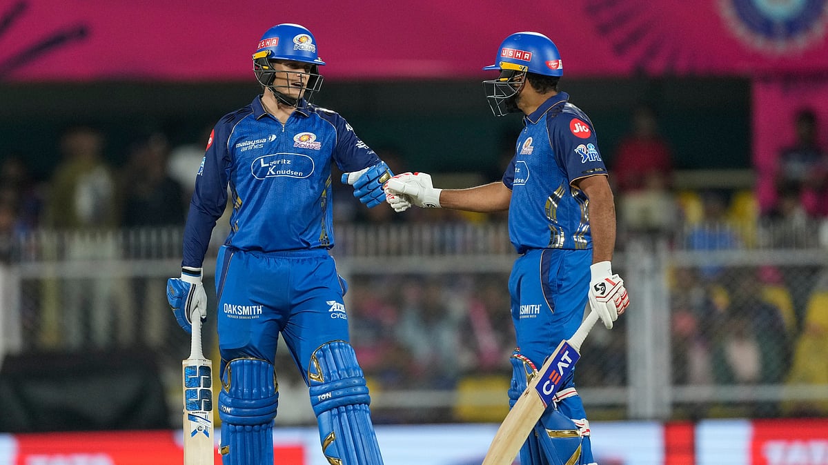 Mumbai Indians' Ryan Rickelton, left, celebrates after hits a six with Rohit Sharma during the Indian Premier League cricket match between Mumbai Indians and Rajasthan Royals in Guwahati, India, Tuesday, April 7, 2026.  - AP Photo