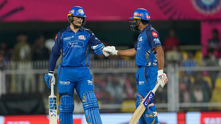Mumbai Indians' Ryan Rickelton, left, celebrates after hits a six with Rohit Sharma during the Indian Premier League cricket match between Mumbai Indians and Rajasthan Royals in Guwahati, India, Tuesday, April 7, 2026. - AP Photo
