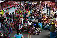 | Photo: Suresh K Pandey/Outlook : Large crowds occupy the New Delhi Railway Station platform, as passengers sit, rest, and wait amid a heavy rush of many going back to their native states due to the LPG crisis.