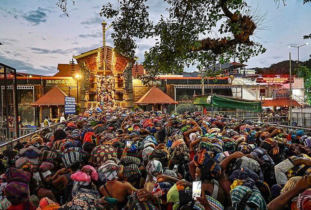 Nine-judge constitution bench to hear review pleas on Tuesday, April 7, 2026, in a case related to the entry of women in the Sabarimala Temple. People are seen waiting to offer prayers at the temple, in Pathanamthitta district, Kerala, in this file photo dated Tuesday, Jan. 13, 2026.  - | Photo: PTI