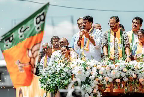 BJP leader K Annamalai, centre, speaks during an election campaign in support of party candidate for Manjeshwaram constituency, K Surendran, second right, ahead of Kerala Assembly Election, in Kasaragod district. 