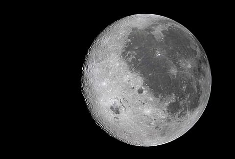 A composite image shows the near side and far side of the Moon, highlighting surface features and lunar terrain. 