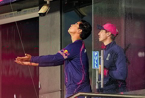 Rajasthan Royals' Vaibhav Suryavanshi looks at the rain from the dugout during an Indian Premier League (IPL) 2026 T20 cricket match between Rajasthan Royals and Mumbai Indians, in Guwahati.