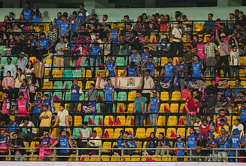 Spectators in the stands amid rain interruption during an Indian Premier League (IPL) 2026 T20 cricket match between Rajasthan Royals and Mumbai Indians, in Guwahati.