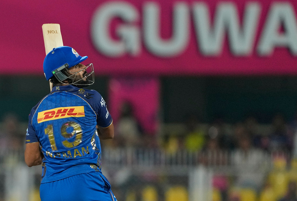 Mumbai Indians' Naman Dhir hits a boundary during the Indian Premier League cricket match between Mumbai Indians and Rajasthan Royals in Guwahati.