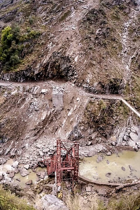 Remains of the under-construction Siyur Bridge over the Ravi River after it was washed away by a landslide on the Holi-Bharmour road, in Chamba district of Himachal Pradesh.