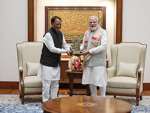 Chhattisgarh CM Vishnu Deo Sai presenting a gift to PM Modi
