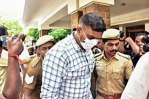 PTI : Police escort a convict outside a court premises in connection with the Sathankulam custodial death case, in Madurai, Monday, April 6, 2026. The court sentenced nine Tamil Nadu policemen to death for the 2020 custodial killing of J Benniks and his father P Jayaraj, terming it a rare case.