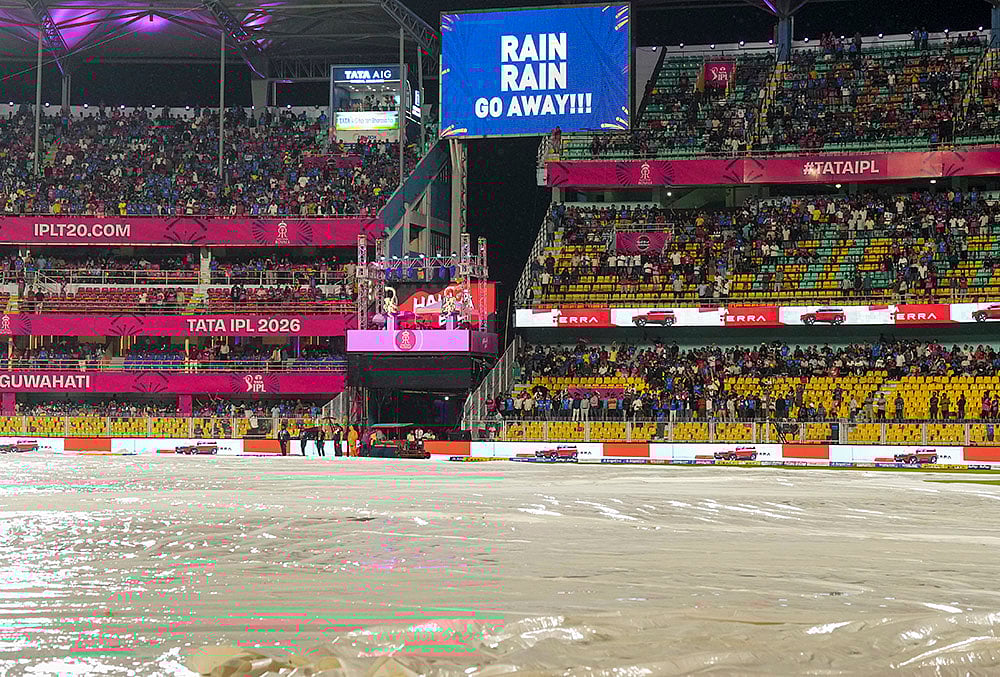 View of the ground covered due to rain during an Indian Premier League (IPL) 2026 T20 cricket match between Rajasthan Royals and Mumbai Indians, in Guwahati. - | Photo: PTI/Swapan Mahapatra
