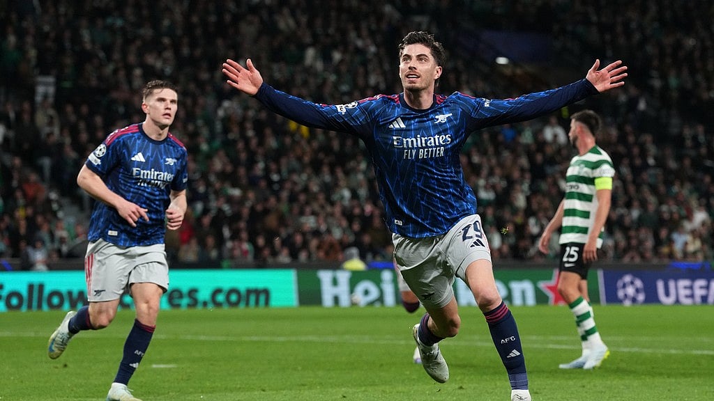 Arsenal's Kai Havertz celebrates after scoring his sides first goal during the Champions League quarterfinals, first leg, soccer match between Sporting CP and Arsenal, in Lisbon, Tuesday, April 7, 2026. - AP Photo/Armando Franca